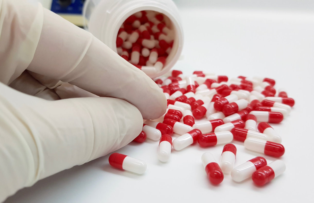 pharmacist counting tablets