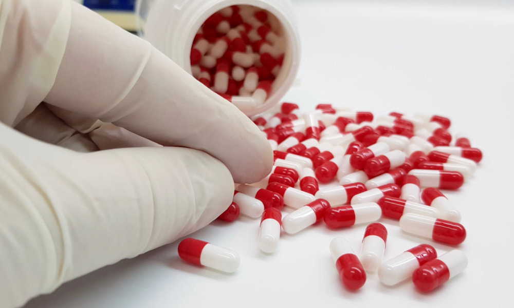 pharmacist counting tablets