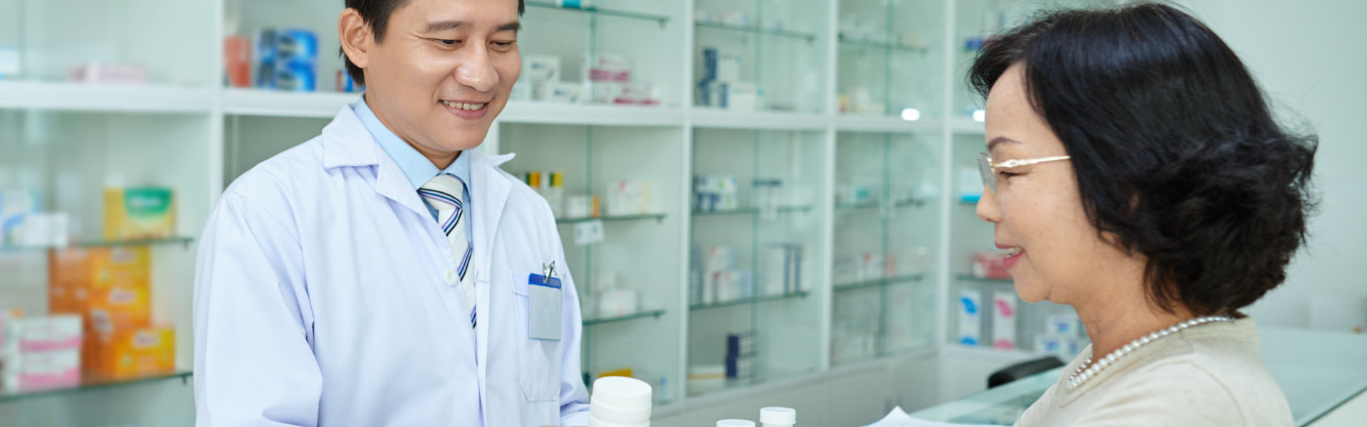 pharmacist smiling at customers