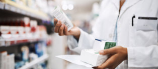 Sometimes you need to combine medicine for maximum effect. Cropped shot of an unrecognizable young female pharmacist working in a pharmacy.