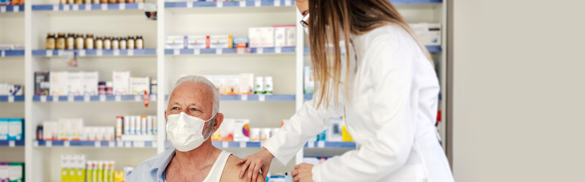 A nurse giving vaccine to senior